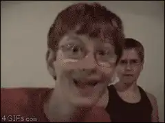 Two boys making funny faces and dancing
