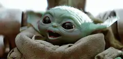 Baby Yoda smiling and looking happy