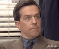 Ed Helms blinking and sighing