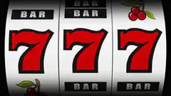 Slot machine reels spinning to 777