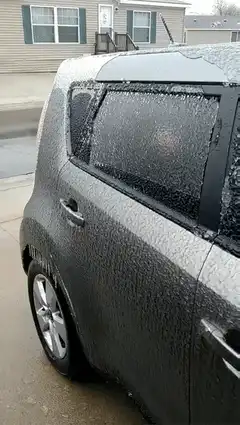 Hand sticking out of frozen car window