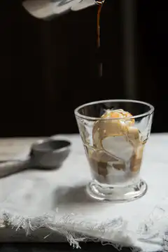 Pouring espresso over ice cream