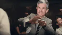 Man shuffling cards with a smirk