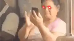 Woman with laser eyes looking at phone