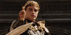 Joaquin Phoenix as Commodus pointing