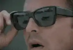 Tony Stark puts on sunglasses