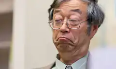 Old man with glasses looking sad