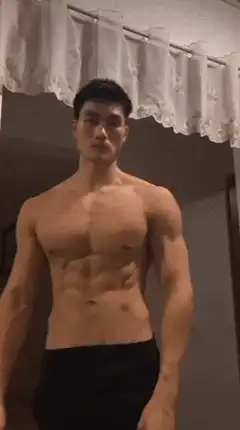 Shirtless man flexing abs