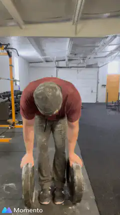 Man lifting heavy weights in gym