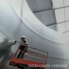Worker on lift with floating toilet paper