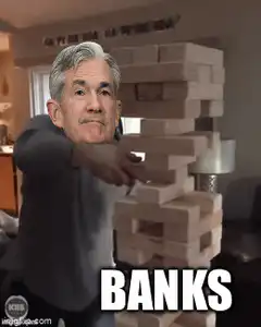 Jerome Powell playing Jenga