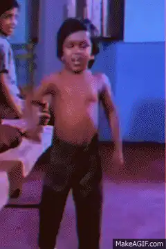 Shirtless boy dancing excitedly