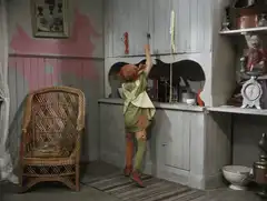 Peter Pan falls into a pile of clothes