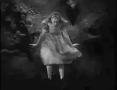 Alice in Wonderland falling down the rabbit hole
