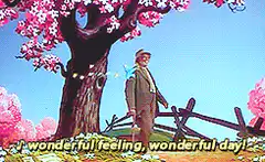 Man under cherry blossom tree with butterflies