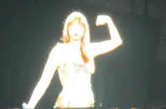 Taylor Swift flexing on stage