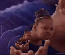 Infinite recursion of a woman holding a smaller version of herself