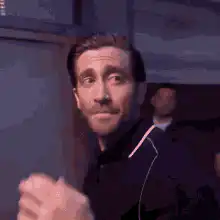 Jake Gyllenhaal blowing a kiss and walking away