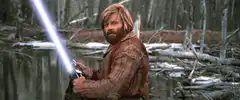 Luke Skywalker lights lightsaber and smiles
