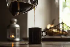 Coffee being poured into a mug