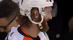 Hockey player laughing with missing tooth