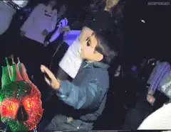 Kid dancing with heart in club