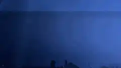 Lightning strike over ocean at night