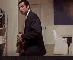 John Travolta looking around confused