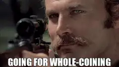 Man aiming rifle winking