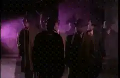 men in suits walking in purple light