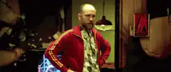 John Goodman in red tracksuit