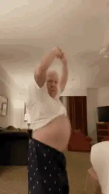 Old man dancing in pajamas