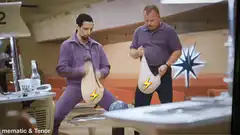 Two men in purple shaking bags with lightning bolts