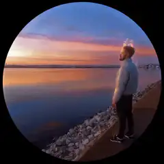 Man watching sunset with light trail