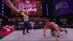 Wrestler with bloody face crawls in ring