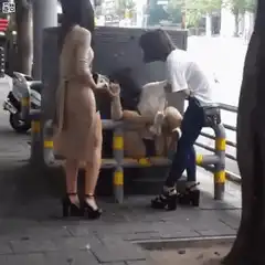Woman falls asleep on public bench