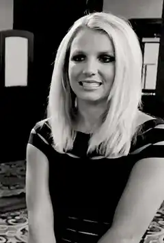Pregnant woman smiling in black and white