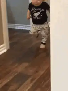 Toddler dancing in black shirt