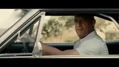 Paul Walker smiling in a car