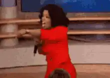 Oprah Winfrey dancing on stage