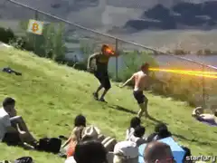 Guy shooting fire from mouth at friend
