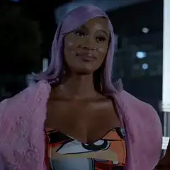Woman with purple hair smirking