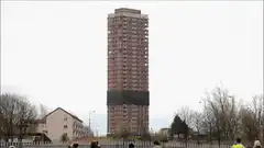 tall brick tower building implosion