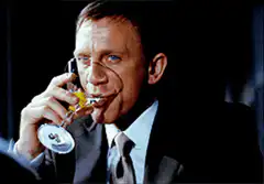Daniel Craig drinks a martini