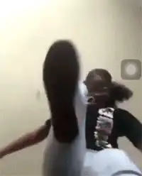 Girl kicks camera with foot