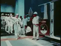 Astronauts dancing in white suits