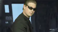 Man in sunglasses smirking