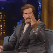 Will Ferrell waving hand