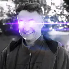 Man with glowing purple eyes