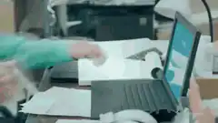 Man slams laptop shut in frustration